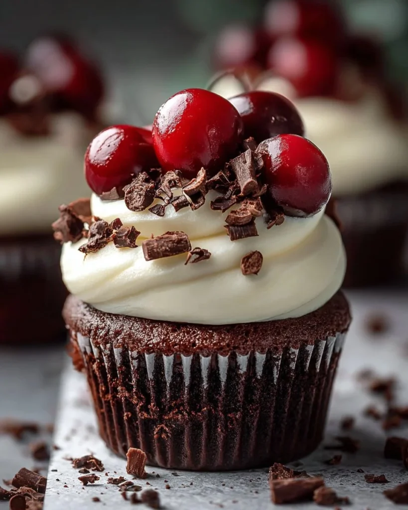 Black Forest mini cheesecakes topped with cherries and chocolate shavings