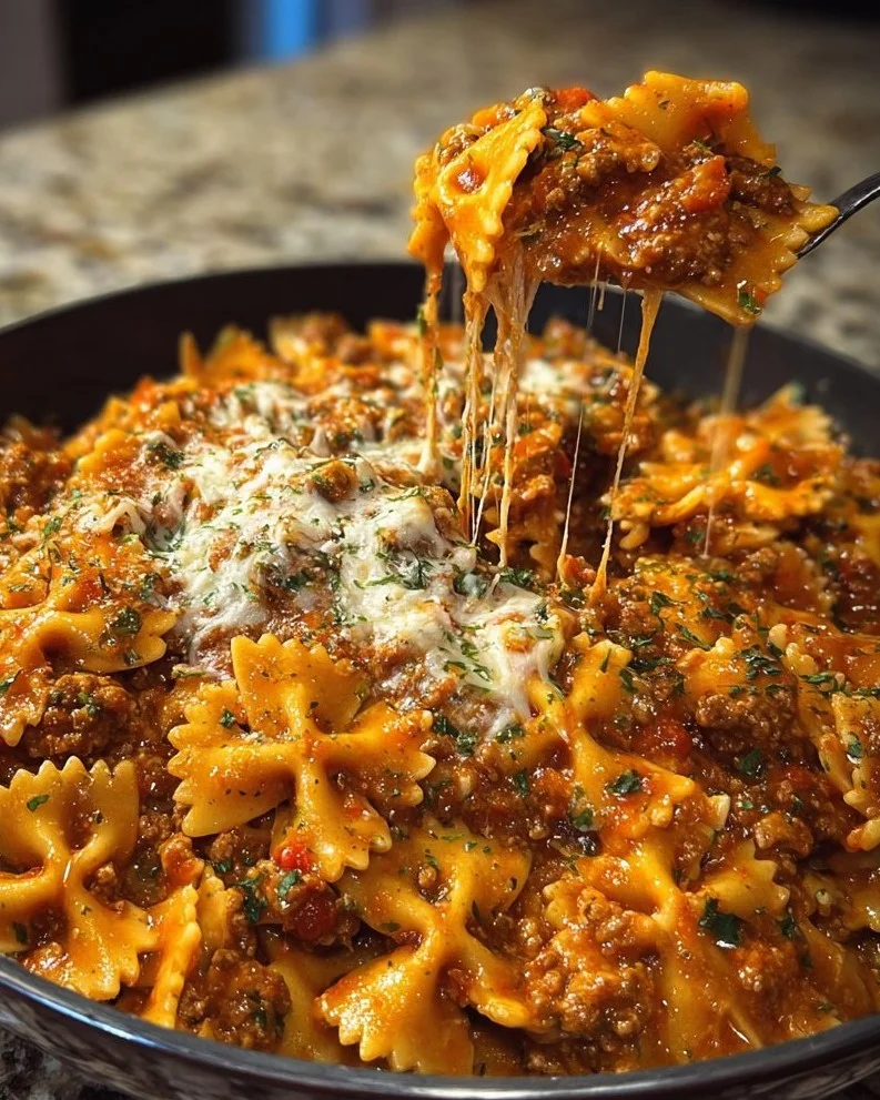 Cheesy bowtie pasta with Velveeta and Italian beef marinara served in a bowl
