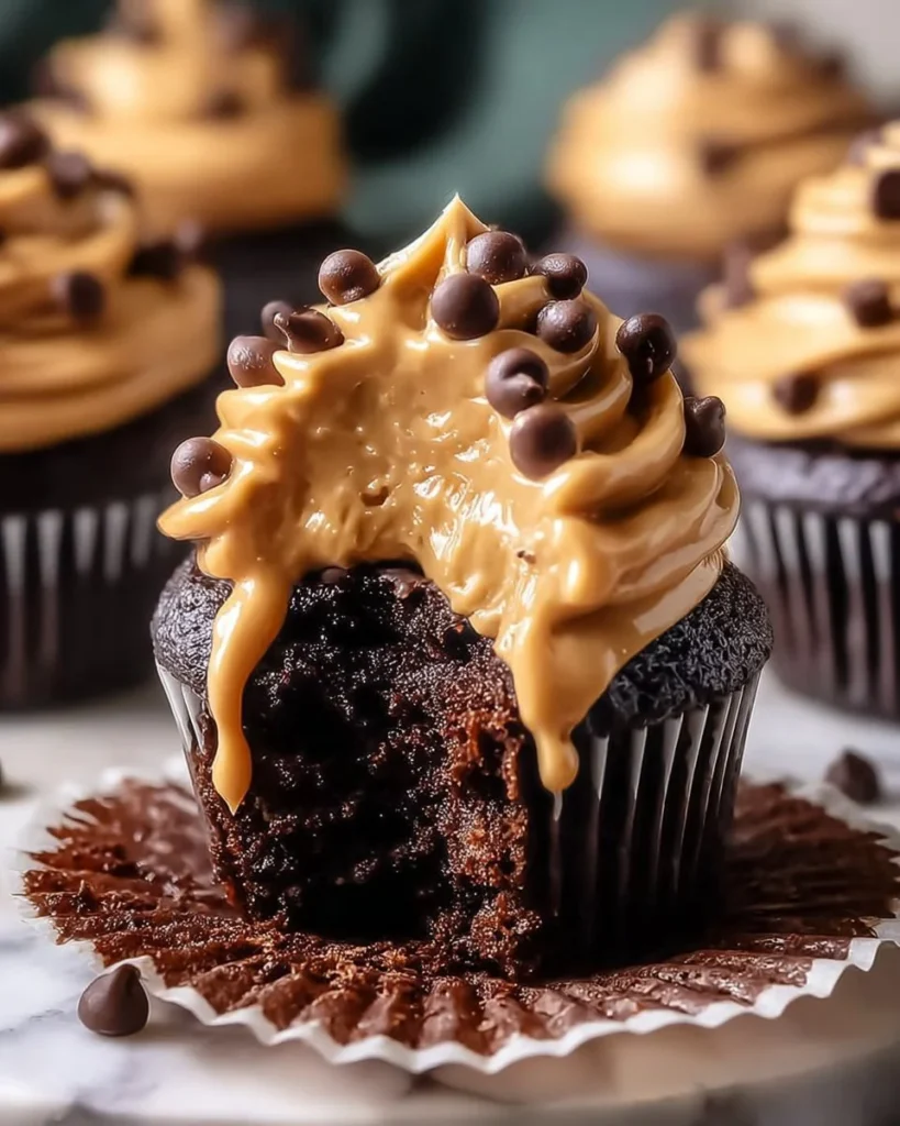 Gooey peanut butter lava cupcakes with rich filling and chocolate drizzle