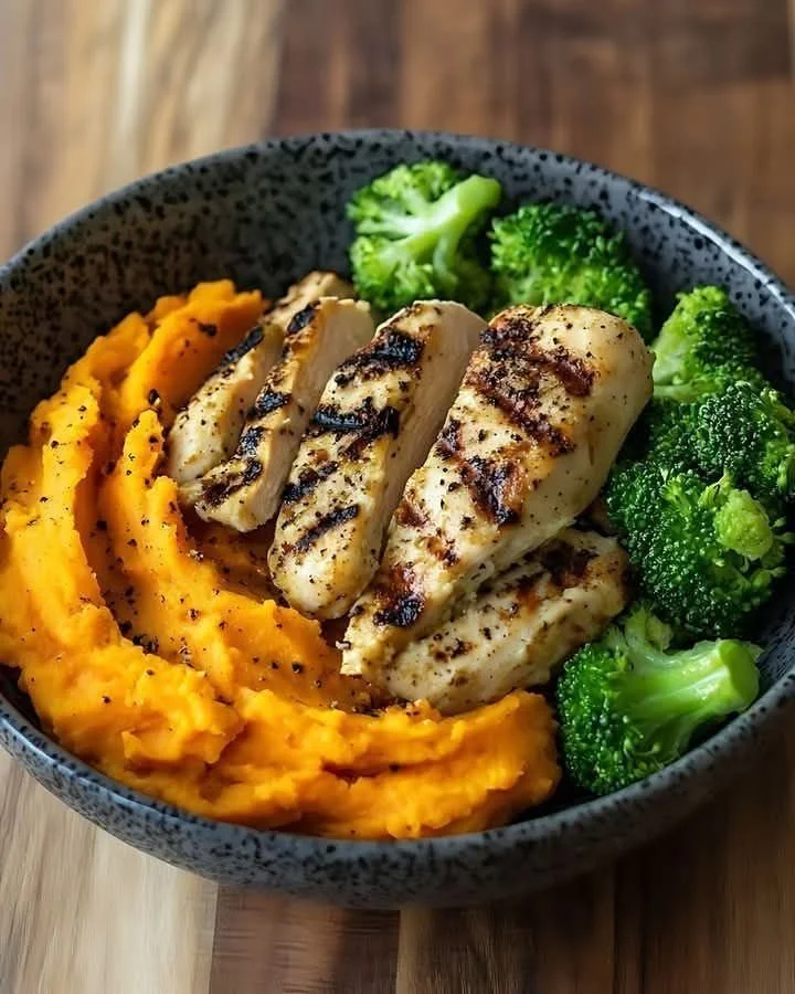 Grilled chicken bowl with mashed sweet potatoes and broccoli