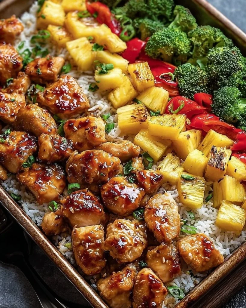 Hawaiian Chicken Sheet Pan with colorful vegetables and pineapple slices.