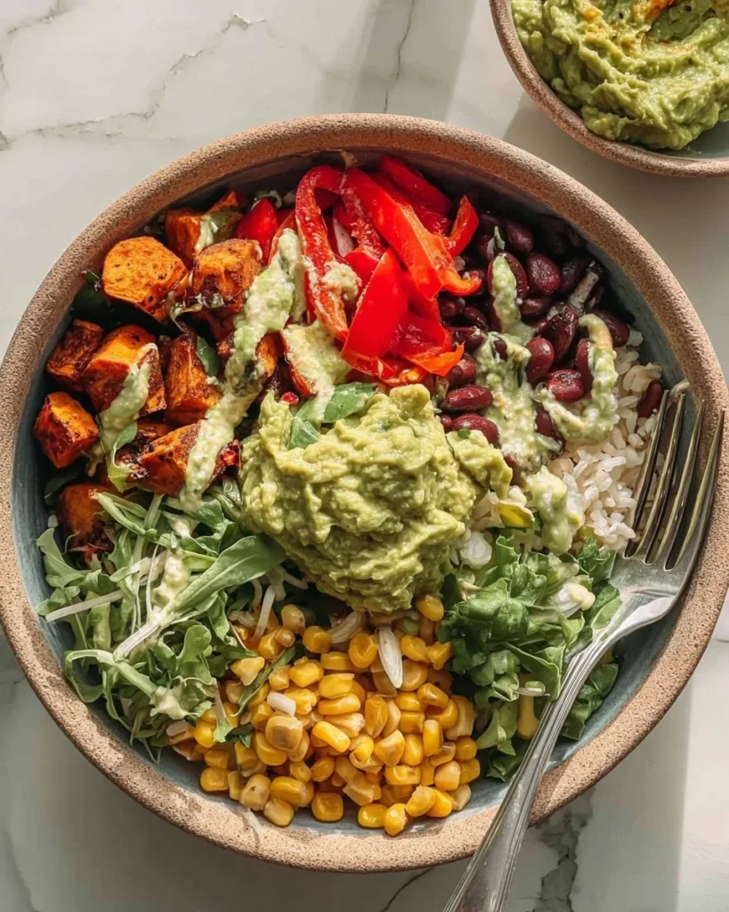 Healthy burrito bowl with sweet potatoes, black beans, and corn ingredients