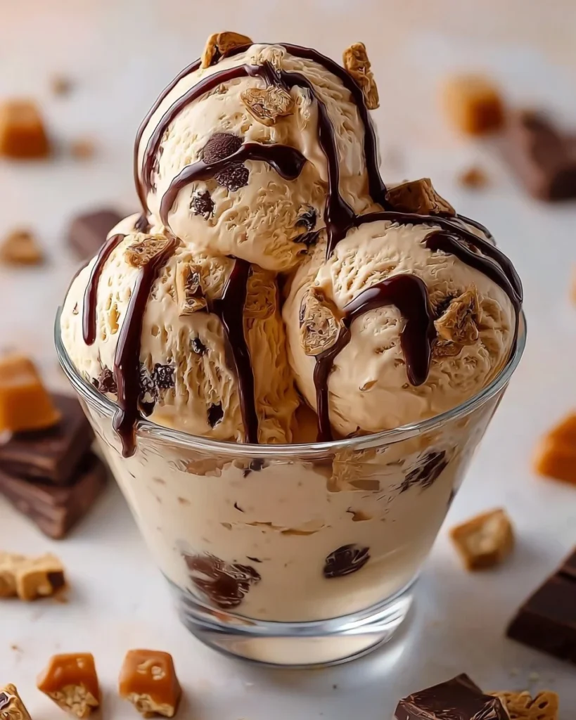 Bowl of homemade Moose Tracks ice cream with chocolate fudge and peanut butter cups