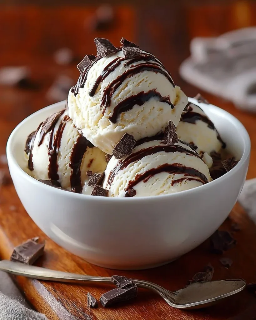 Delicious bowl of homemade Moose Tracks ice cream with fudge and peanut butter cups