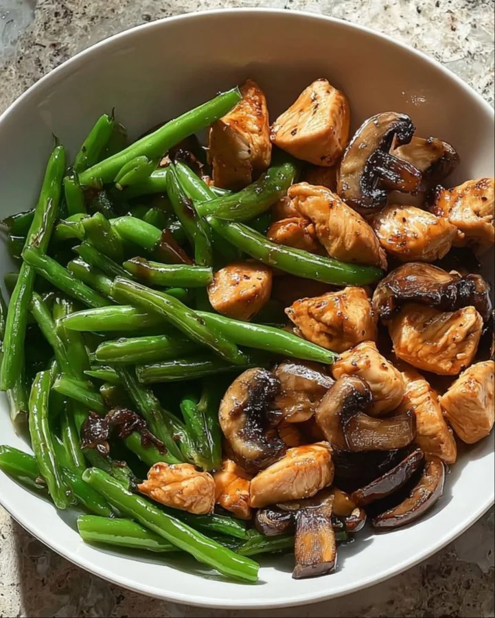 Honey Garlic Chicken Bowl topped with sautéed vegetables for a healthy meal