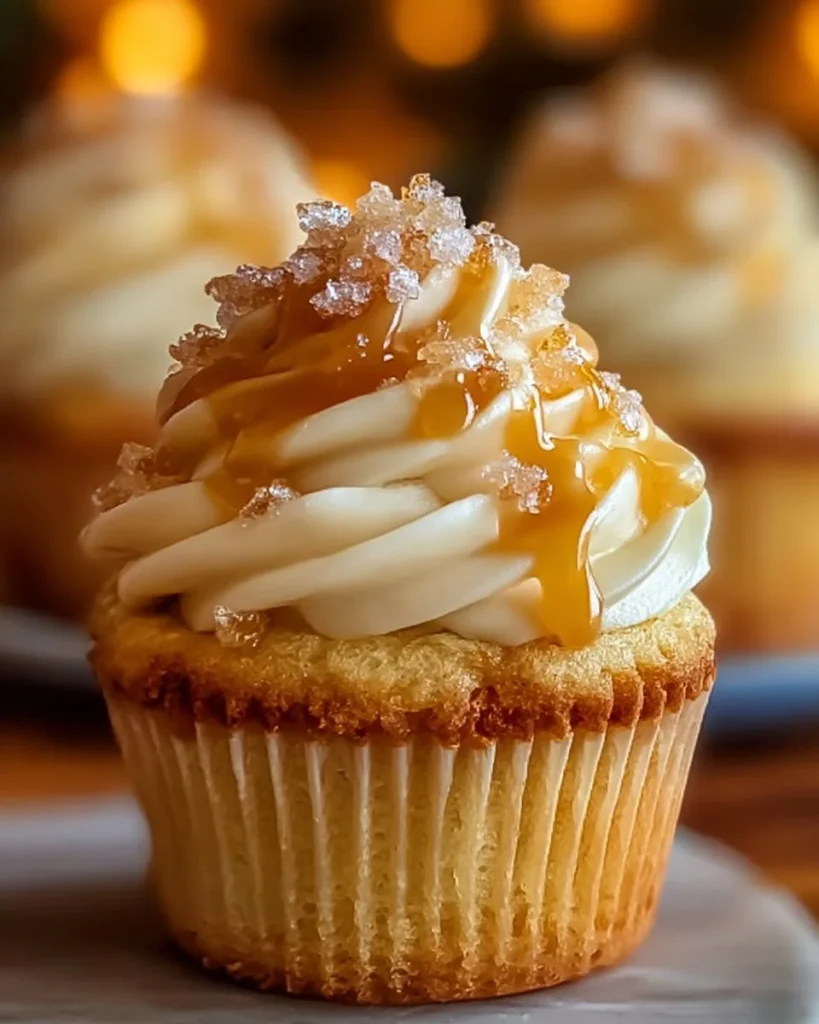 Honey Peach Cream Cheese Cupcakes topped with peach slices and cream frosting
