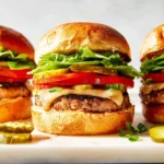 Juicy low-fat turkey burgers on a grill, ready to serve