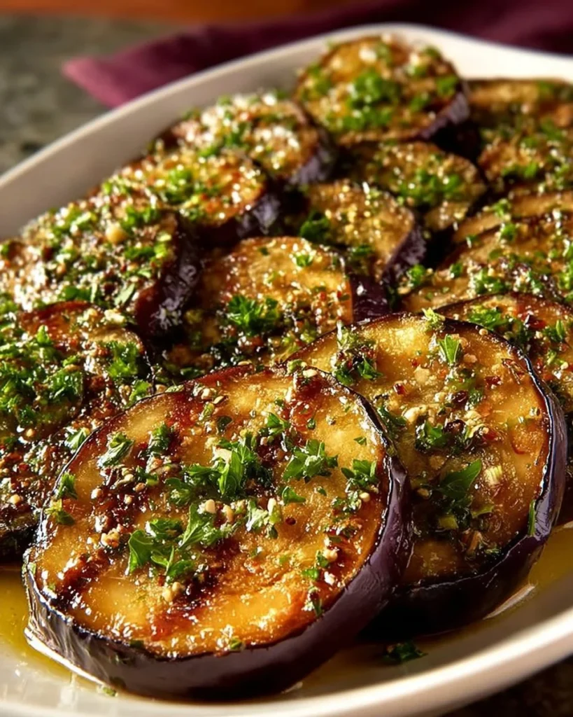 Mediterranean Lemon Garlic Roasted Eggplant dish garnished with herbs
