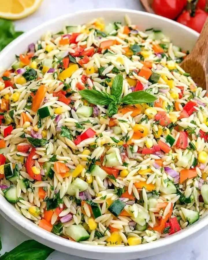 Mediterranean Lemony Rainbow Orzo Salad with colorful vegetables and fresh herbs