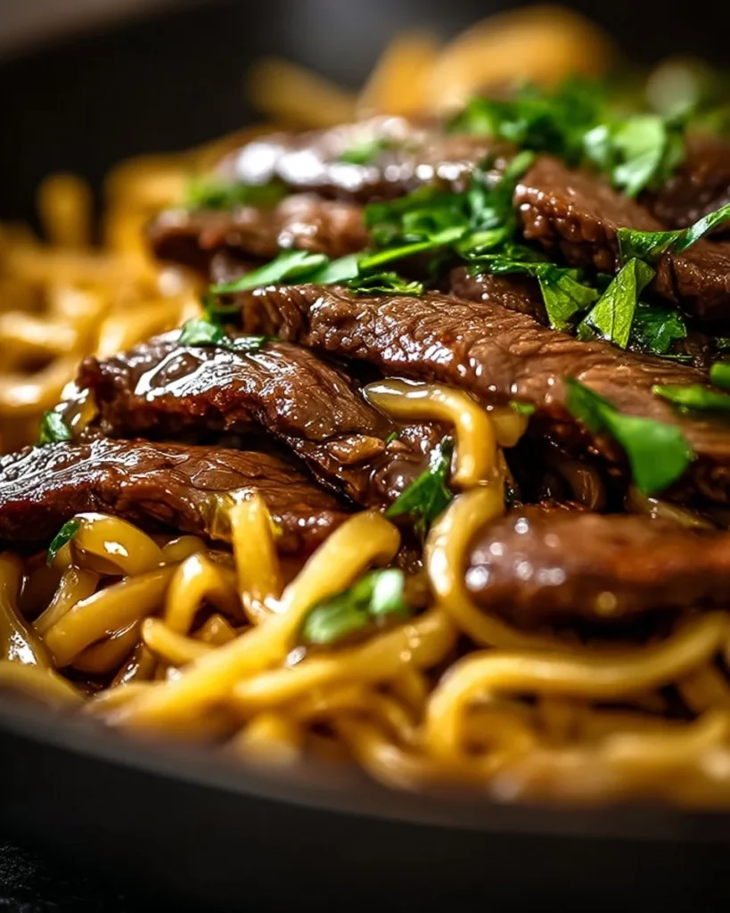 One-Pot Smoky Honey BBQ Steak Pasta served on a plate with herbs and spices