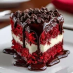 Slice of Red Velvet Cookie Dough Cheesecake on a plate