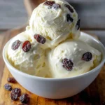 Rich and creamy rum raisin ice cream served in a dessert bowl