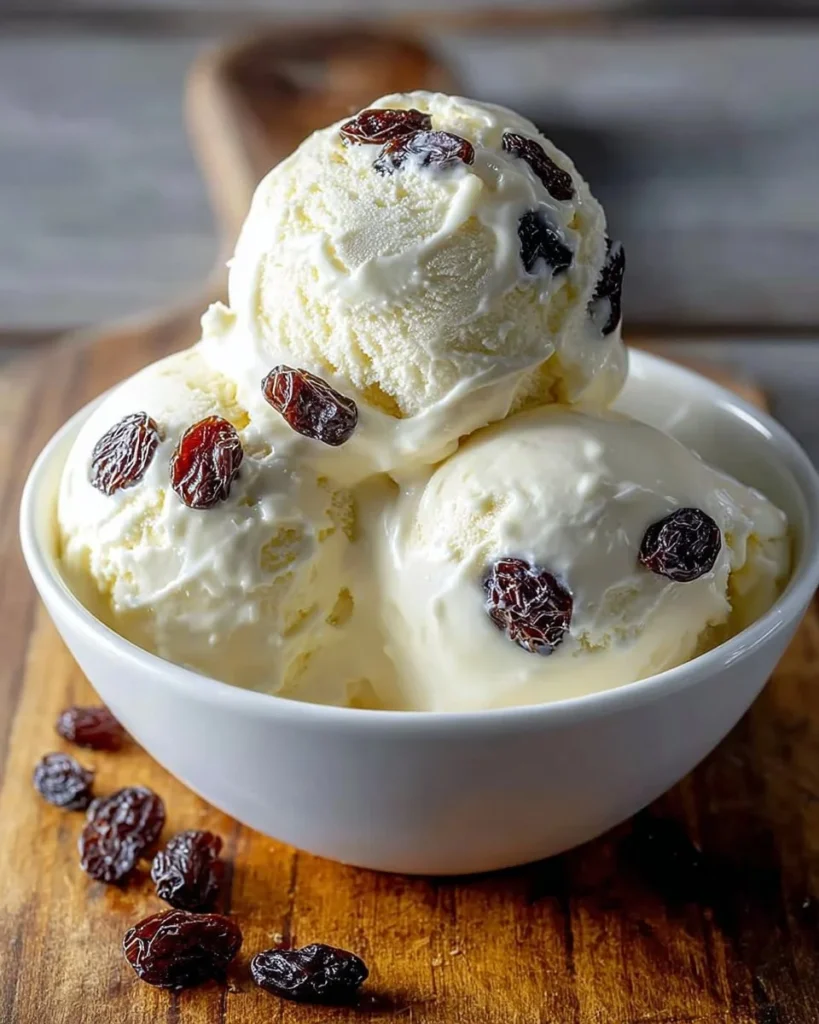 Rich and creamy rum raisin ice cream served in a dessert bowl