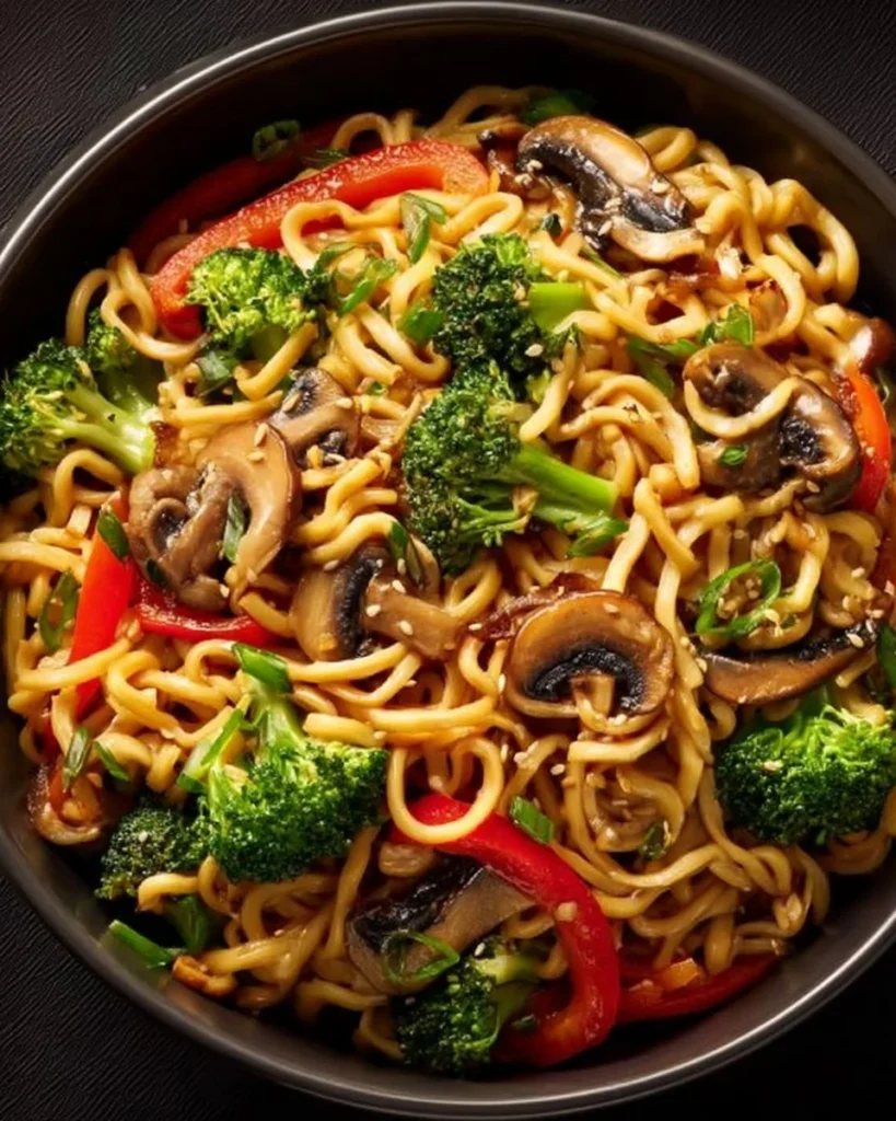 Bowl of delicious Vegan Chow Mein with colorful vegetables and noodles